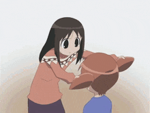 Osaka quitandole sus coletas a Chiyo Mihama.